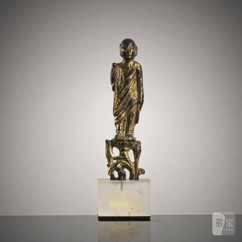 A GILT-BRONZE FIGURINE OF A LEHAN